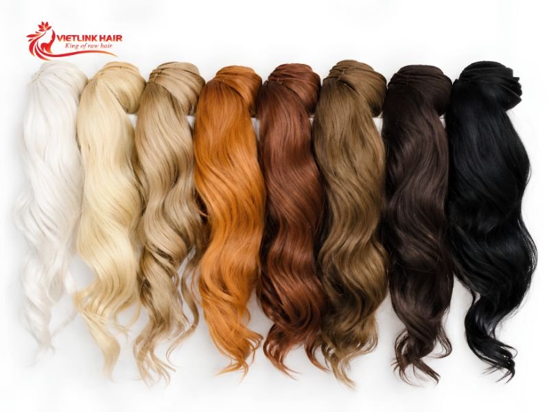 Dyeing human hair extensions requires even application and careful sectioning.