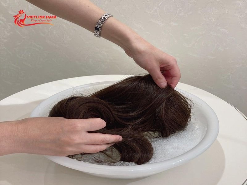 Detangle the dry wig gently from the ends toward the roots.