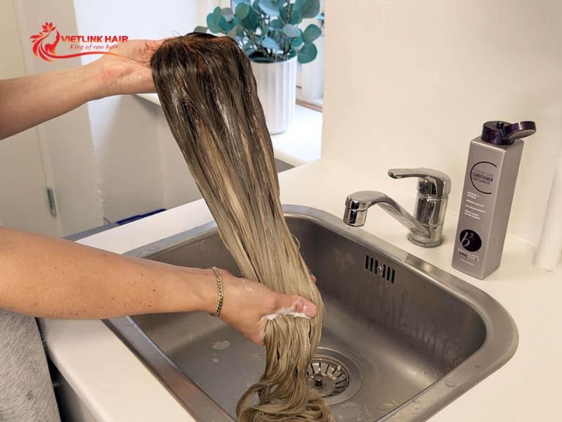 Apply conditioner mainly to the mid-lengths and ends, avoiding the knots.